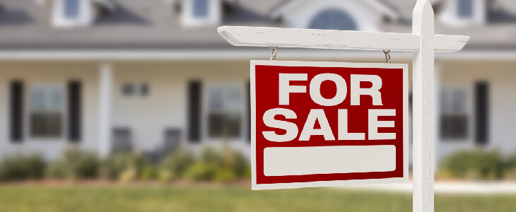 for sale sign in front of a house real estate litigation